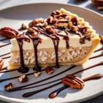 Slice of Peanut Butter Rice Krispie Ice Cream Pie with chocolate topping