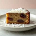 Moist Coconut Date Cake Slice on Plate