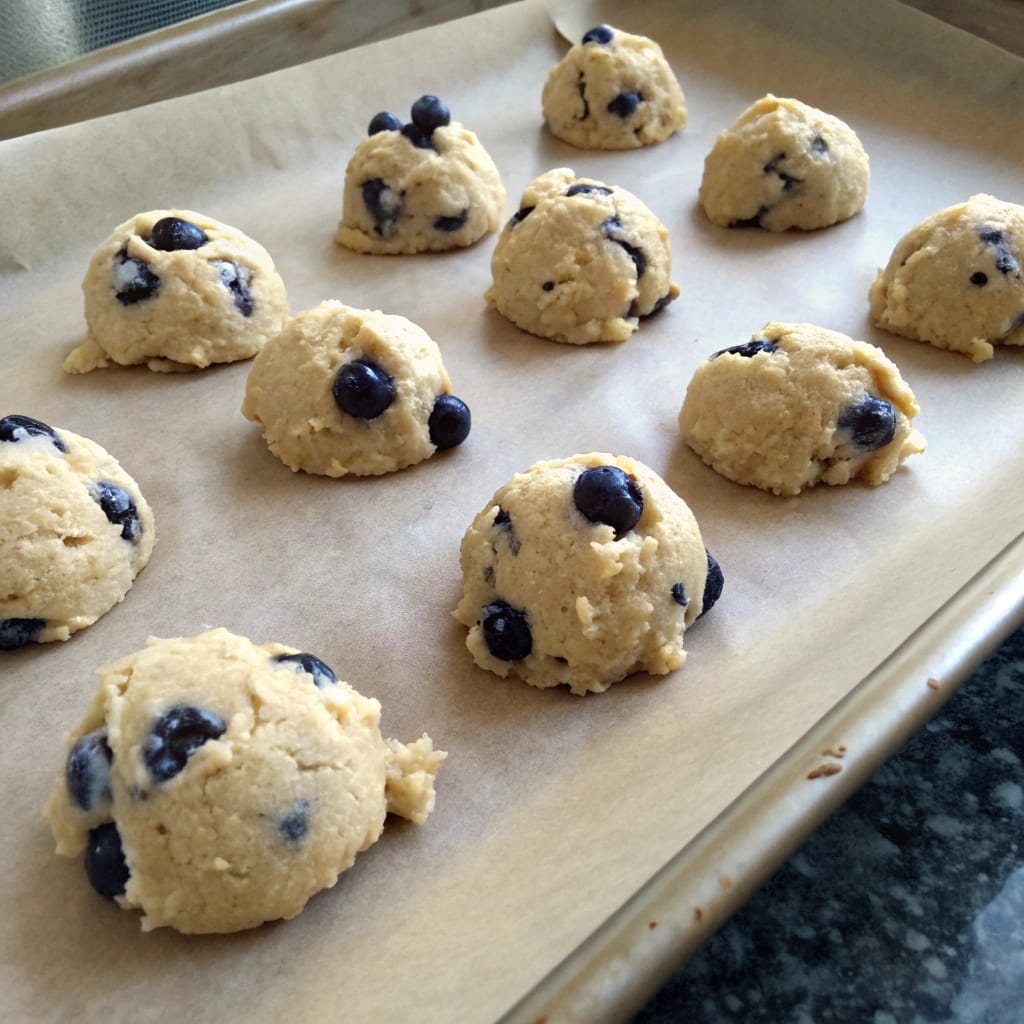 Raw blueberry cookie dough on baking sheet