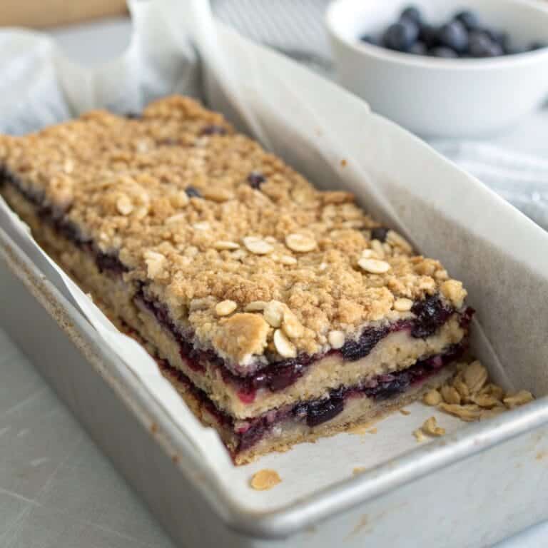 Blueberry Oat Bars layered in loaf pan before chilling