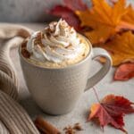 Pumpkin Chai Latte topped with whipped cream and cinnamon